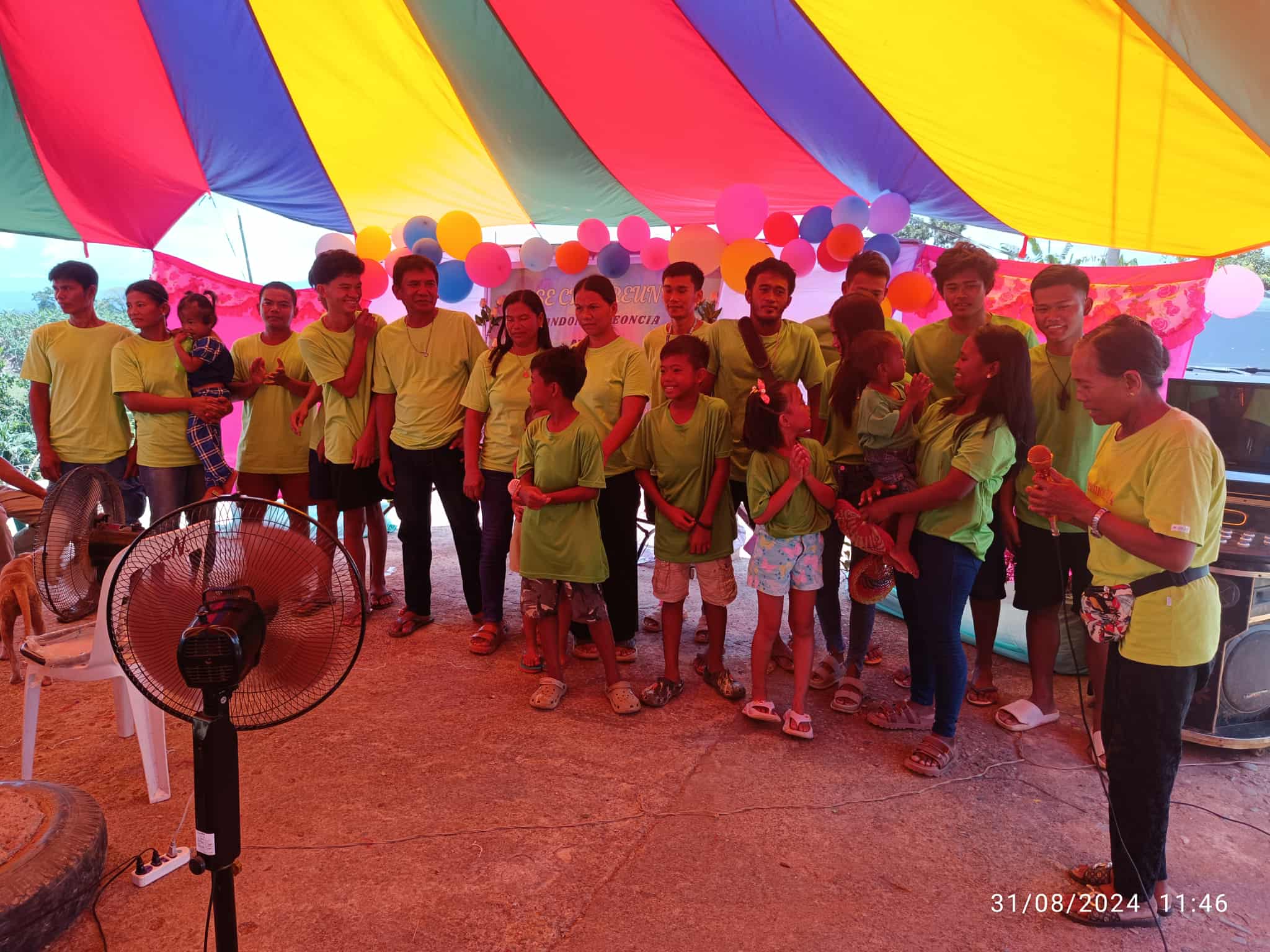 Family reunion in matching shirts with balloons