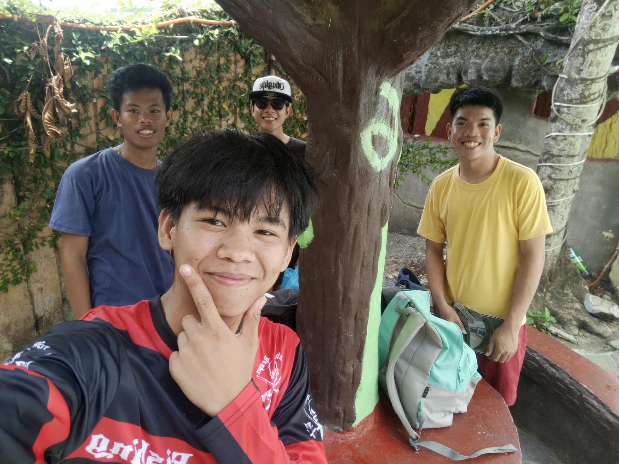 Birthday group photo by the painted tree