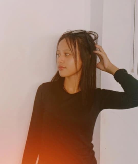 A child standing near a bench